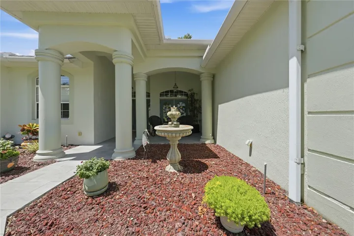 Water fountain prelude to front porch