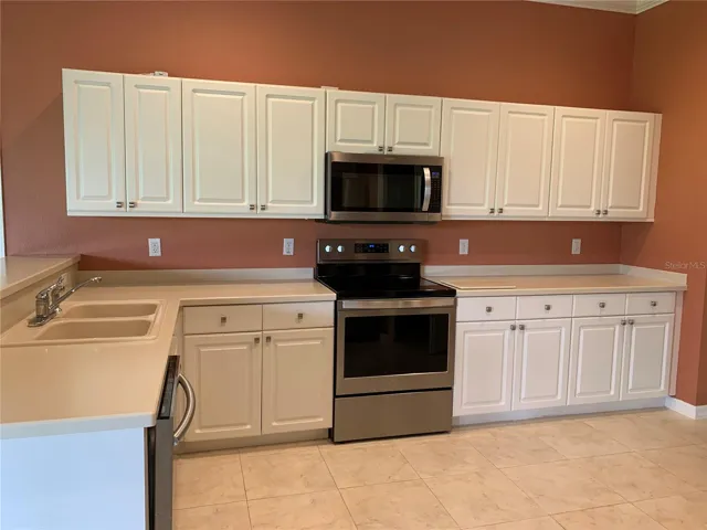 Kitchen has plenty of cabinets and storage