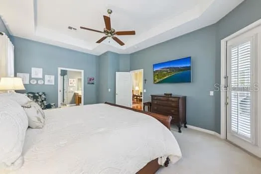 Primary Bedroom with door to the right leading to pool, patio area
