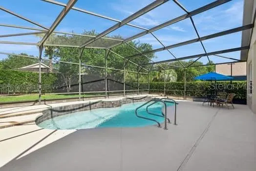 Beautifully maintained screen enclosed pool and patio area.  Pool refinished - 2022 & pool surround painted & sealed in 2025 plus 5 pool screens replaced in 2026 plus 13 replaced in 2026