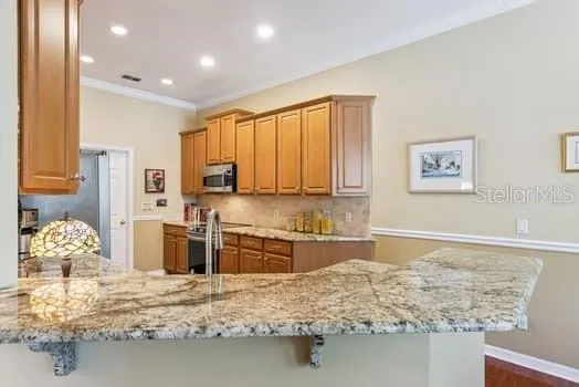 Recessed lighting, chair-rail molding in eat-in area