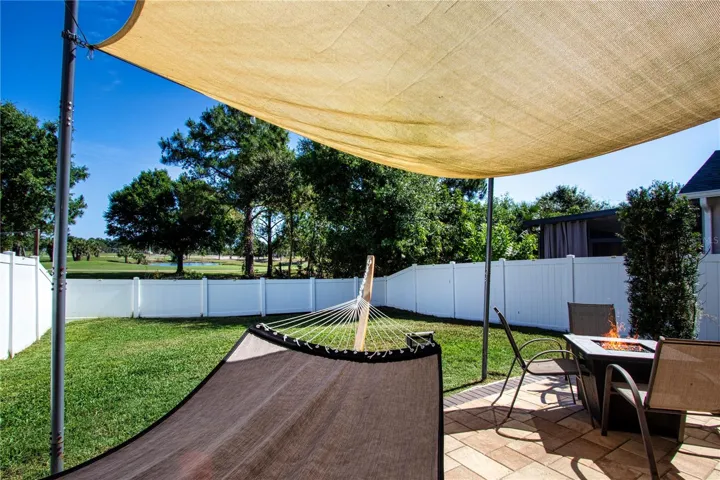 Fully Fenced In Back Yard With Water and Golf Course View