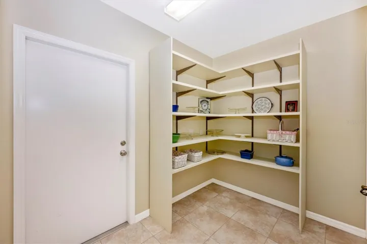 Kitchen Walk-in Pantry, door to garage, 2nd closet to right