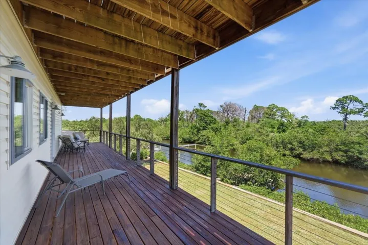 Covered balcony/deck 2nd level- Primary and 3rd bedroom Access