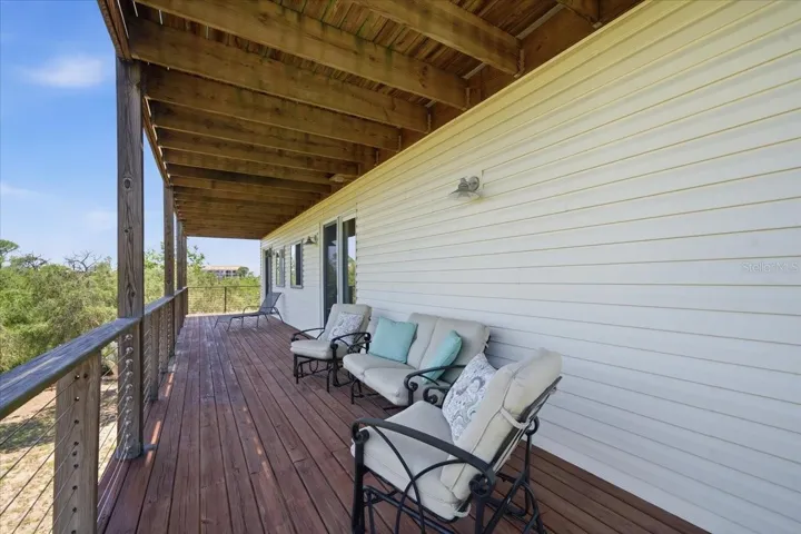 Covered balcony/deck from 2nd level-Primary and 3rd bedroom access