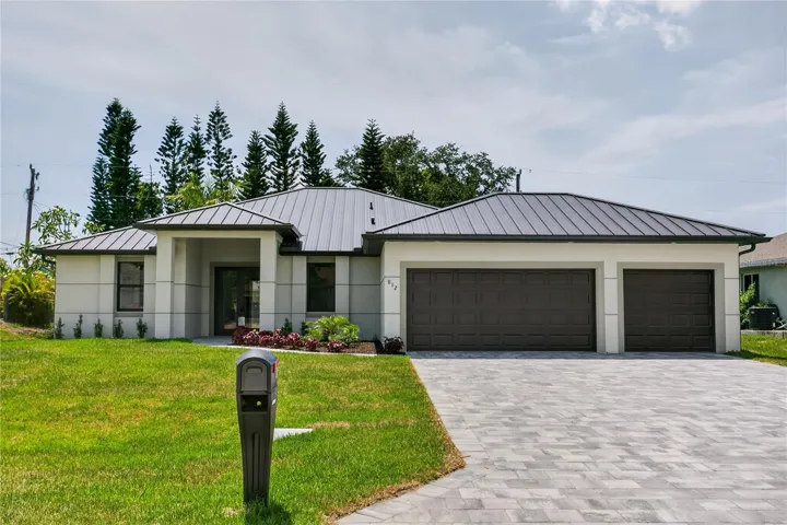 This CONTEMPORARY LUXURY HOME features SCREENED, HEATED POOL & SPA & 4 BEDS (2 primary suites) & 3 full BATHS, layout is ideal for EVERYDAY LIVING & ENTERTAINING!