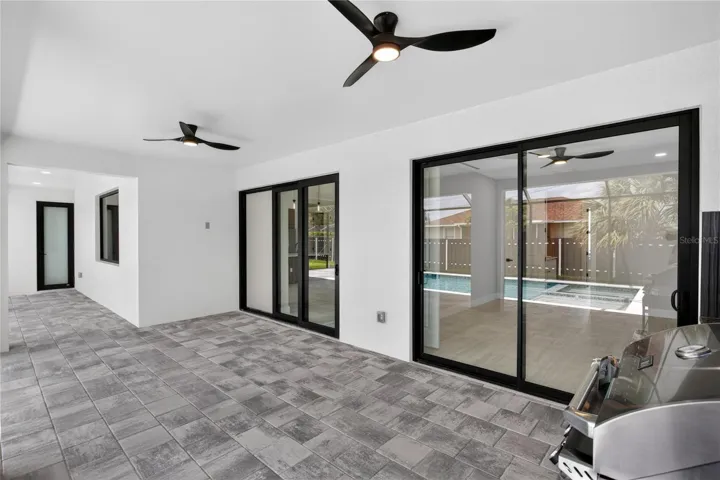 PAVER FLOORING & CEILING FAN create COMFORTABLE SPACE for YEAR-ROUND ENJOYMENT.