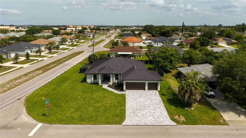 Desirable CORNER LOT offers extra yard space, enhanced curb appeal & added flexibility for outdoor living and everyday convenience!