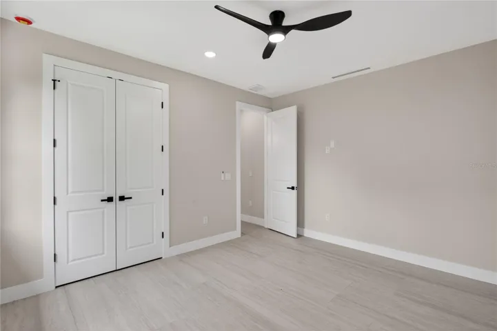 SPLIT LAYOUT offers SECOND PRIMARY SUITE w/ POOL BATHROOM & TWO GUEST BEDROOMS w/ HALL BATHROOM for added privacy.