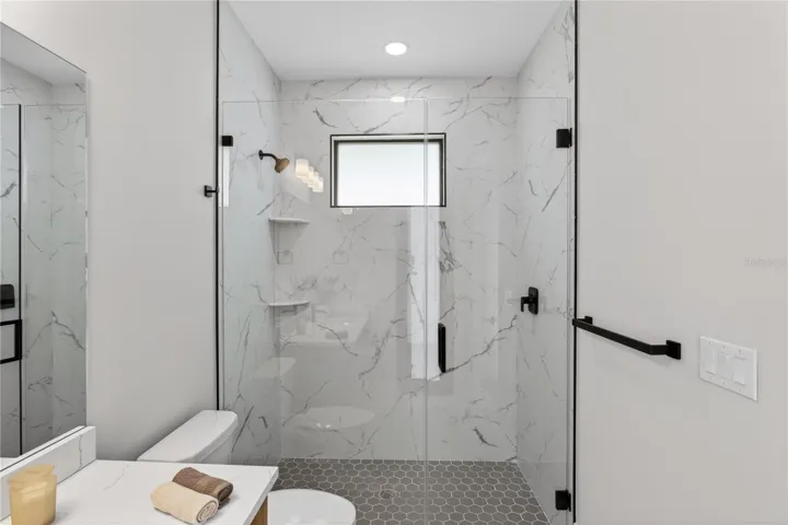 Convenient POOL BATHROOM allows easy access from outdoor living areas, perfect for entertaining & Florida pool days!