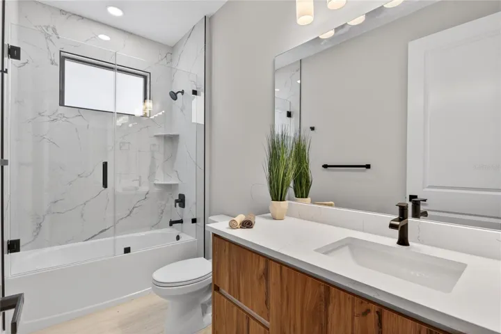 THIRD GUEST BATHROOM located off the hallway offers convenient access for family, guests & everyday living!