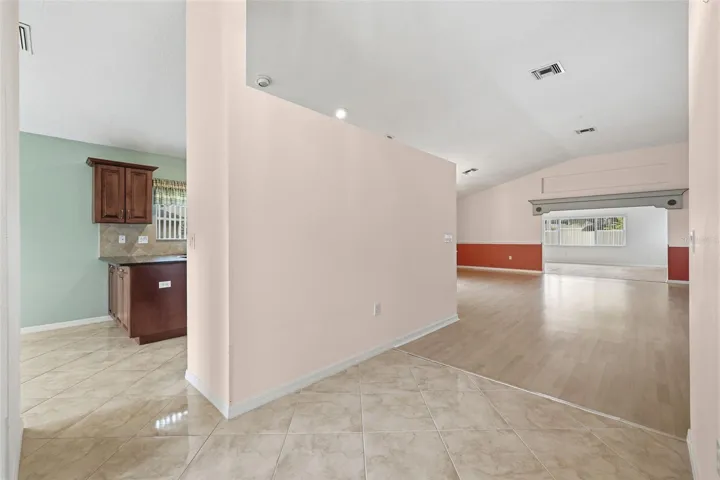 Entryway. Kitchen and breakfast nook to the left. Dining (left after the wall), Living, and Bonus rooms.
