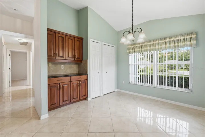 Spacious and bright breakfast nook. Two pantry closets. Neutral and pristine tile.