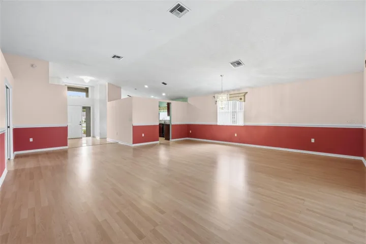 View from Living area toward entryway and kitchen.