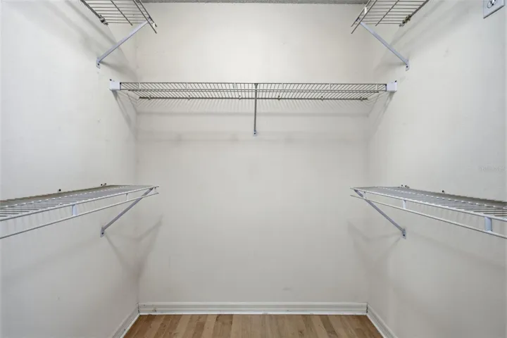 One of two equal-size walk-in closets in Primary bedroom.