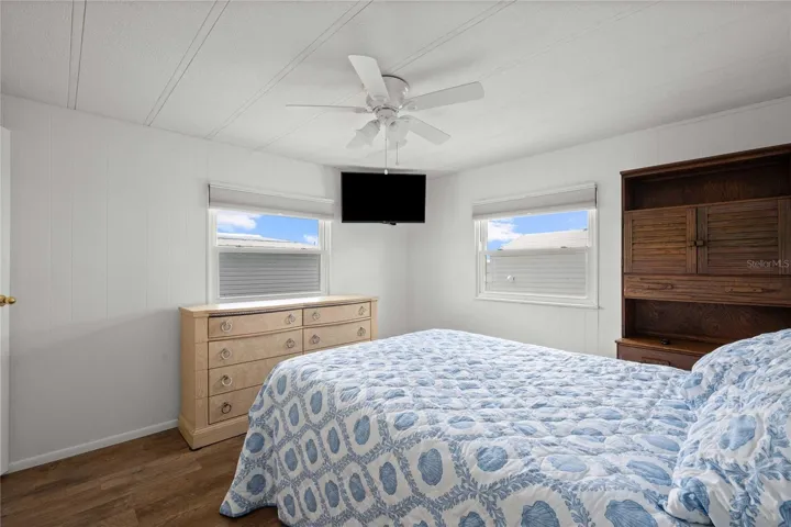 The primary bedroom accommodates a king size bed.