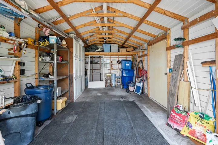 This she is 20 X 12 and fits a golf cart and you still have roof for works space or storage