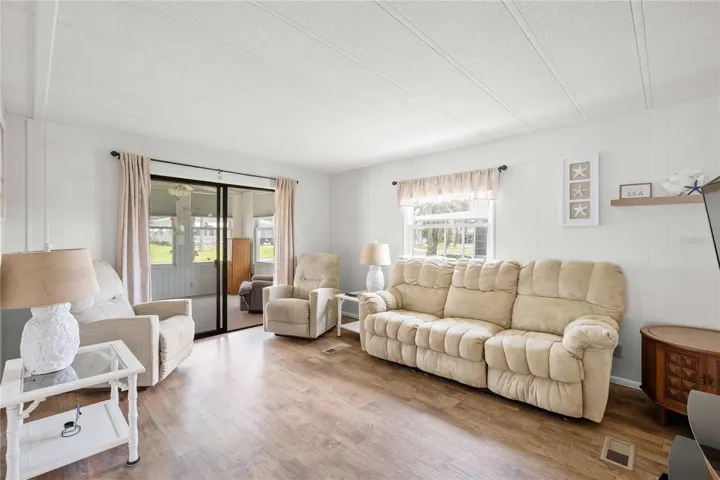 The living room is spacious and bright
