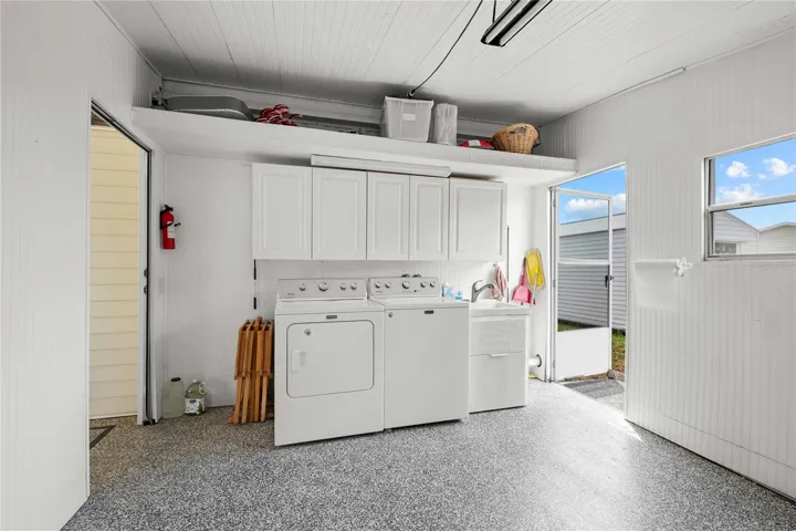 The laundry is off the lanai, has a sink and plenty of room for storage.