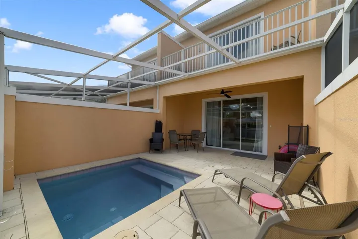Sliding glass doors open to a covered lanai that overlook a private plunge pool!