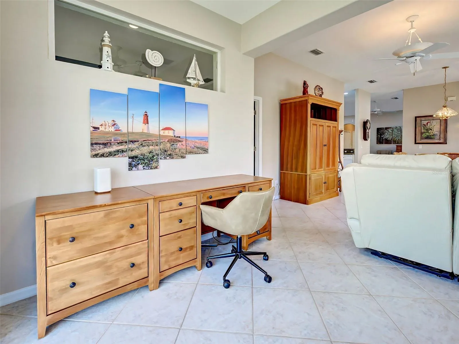 The den is large, currently room for a desk and cabinet.
