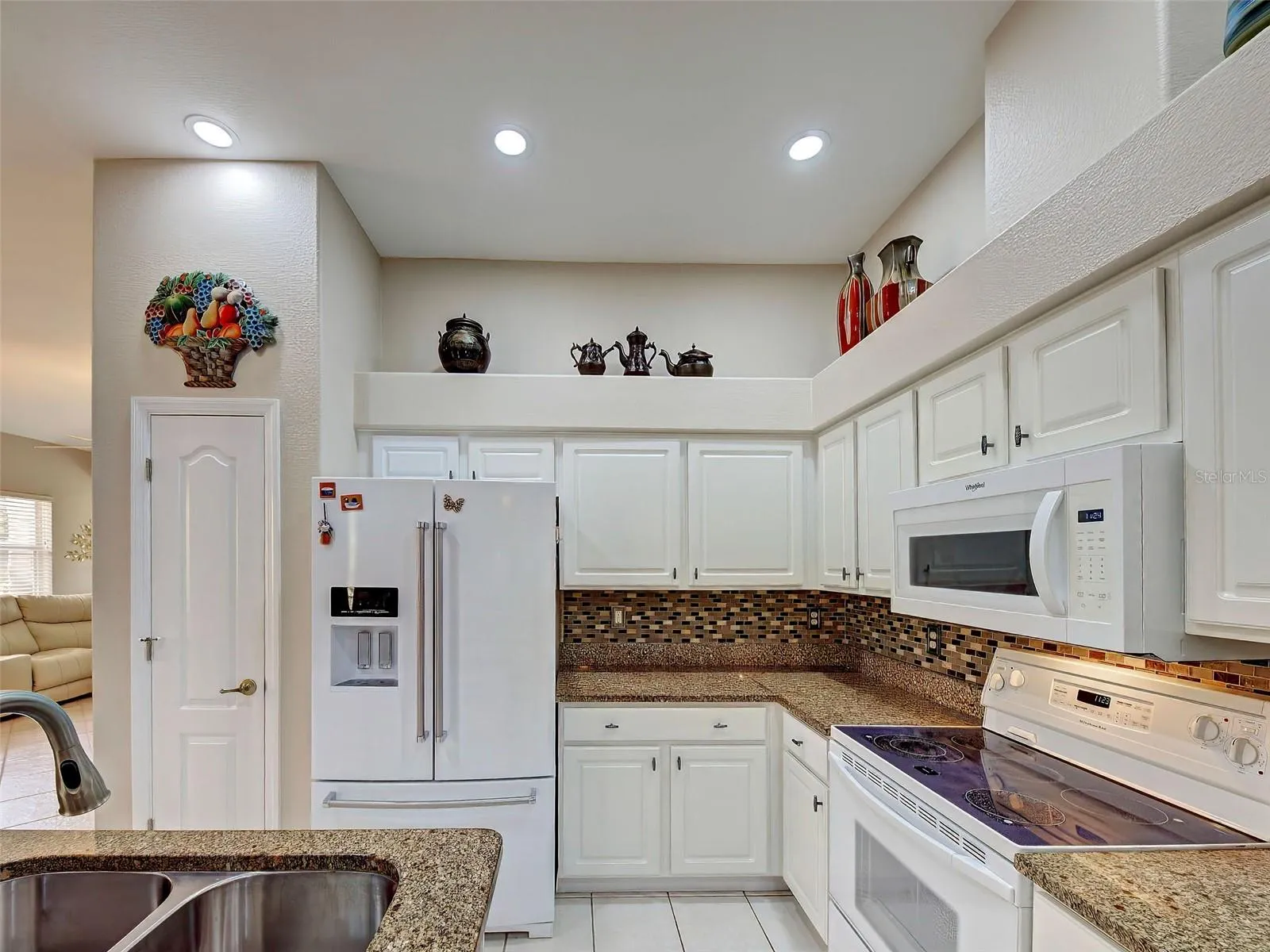 Not only is there a lot of cabinet space there is also a pantry in the kitchen.