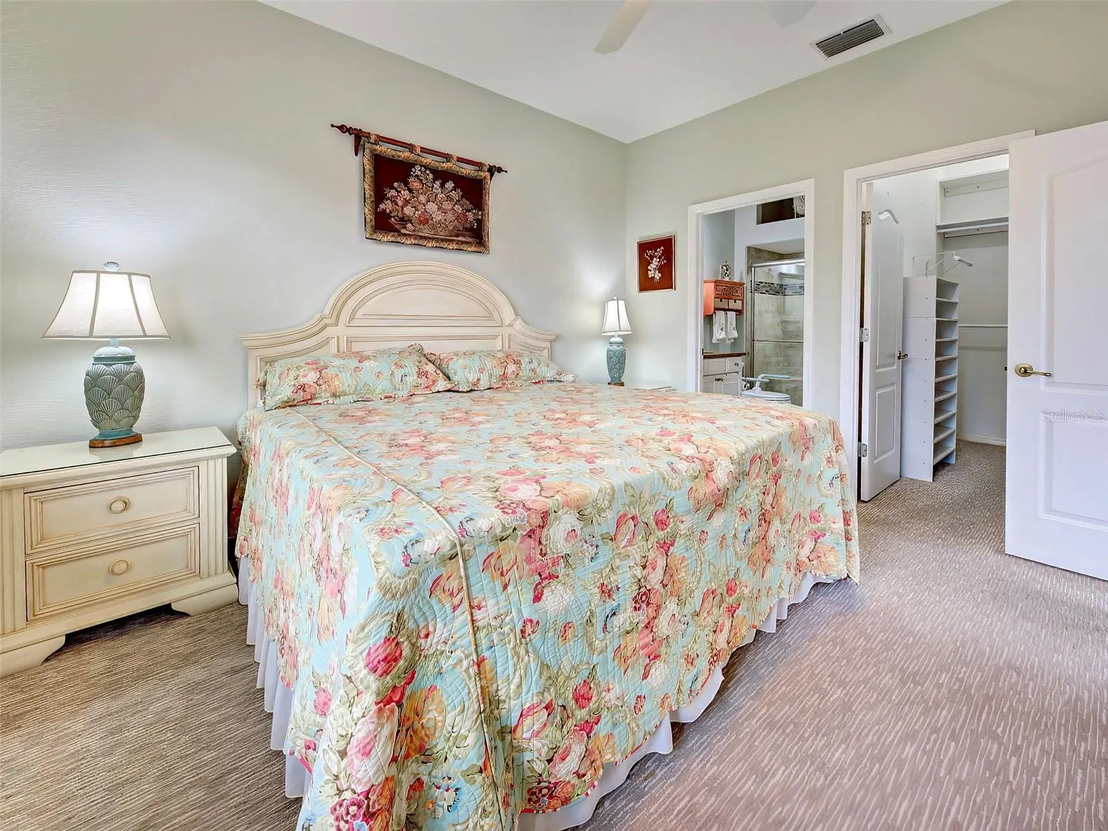 The carpeted primary bedroom has a walk-in closet and an ensuite bathroom.