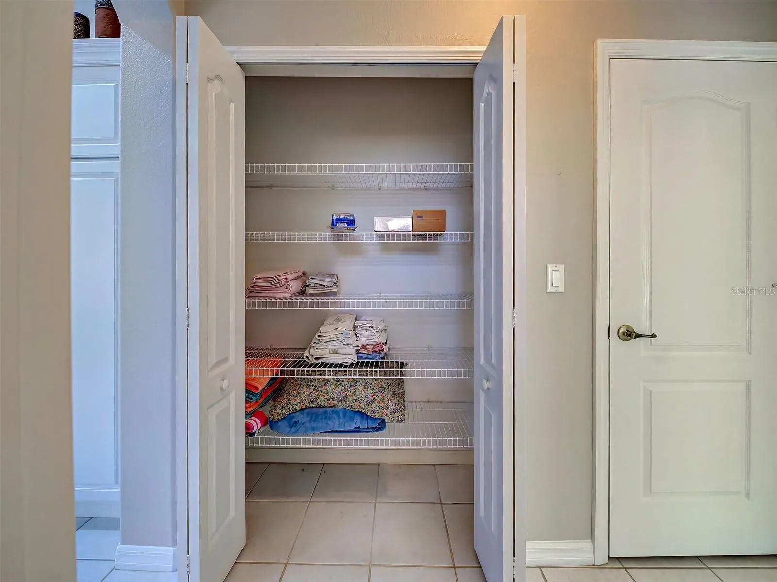 There is a large linen closet in the hallway.