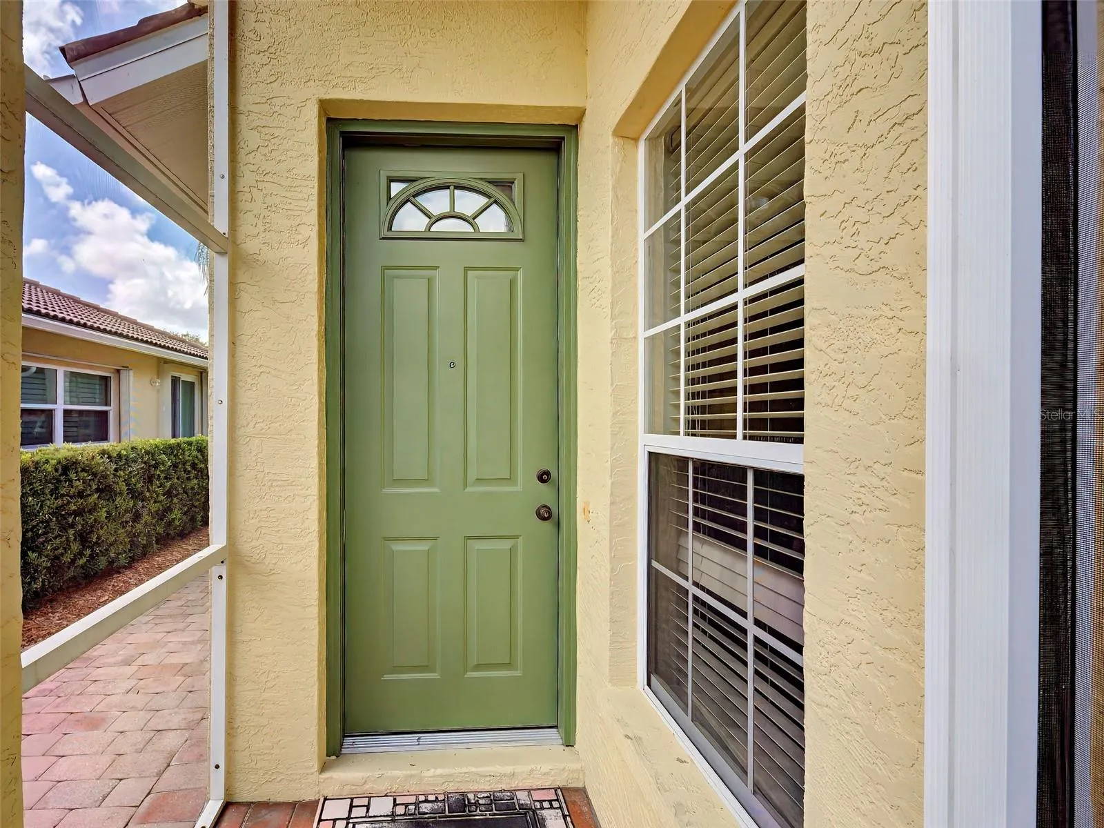 Enter the home with open floor plan through the front door.
