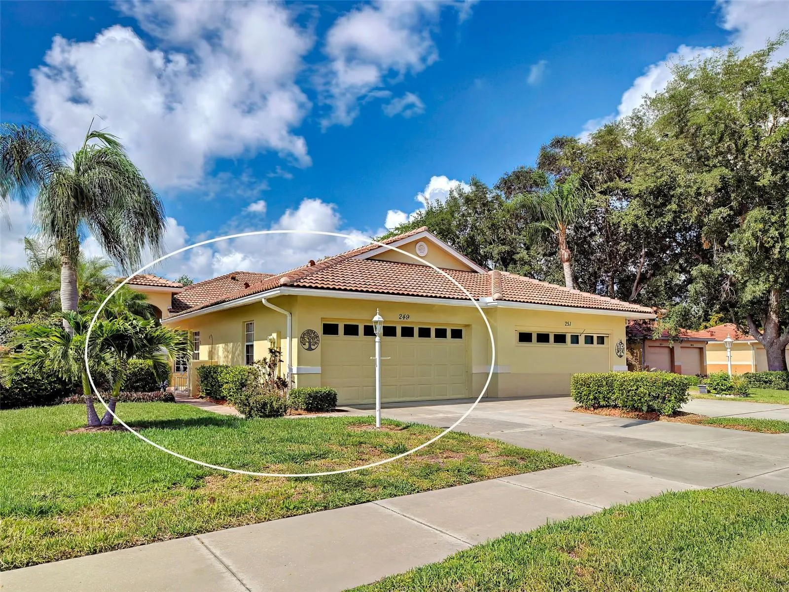 This Florida-style home has wonderful curb appeal with tropical landscaping.