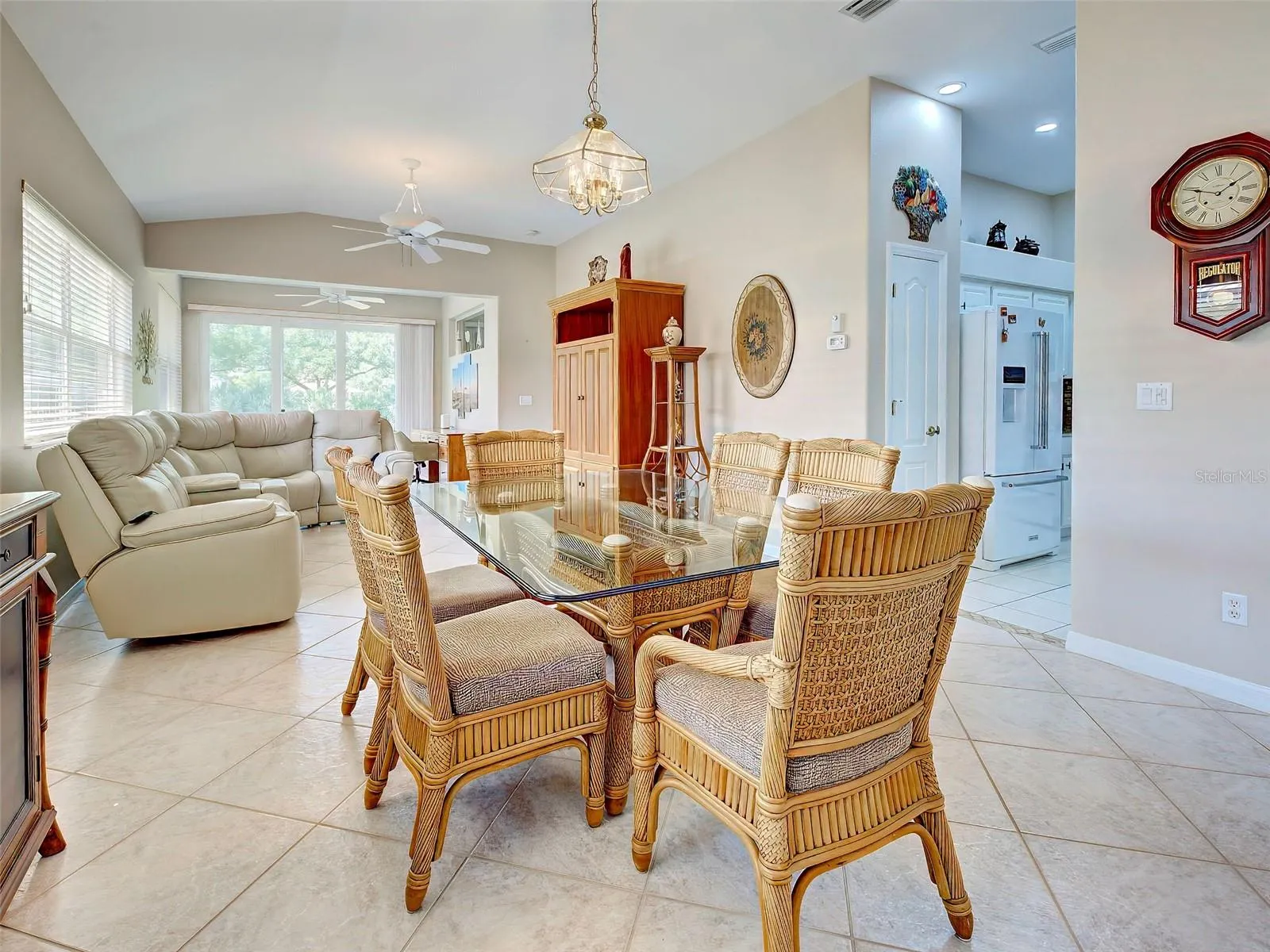 You are greeted with high ceilings and an open view out the lanai to the pond.  Tasteful tile is laid on a diagonal.