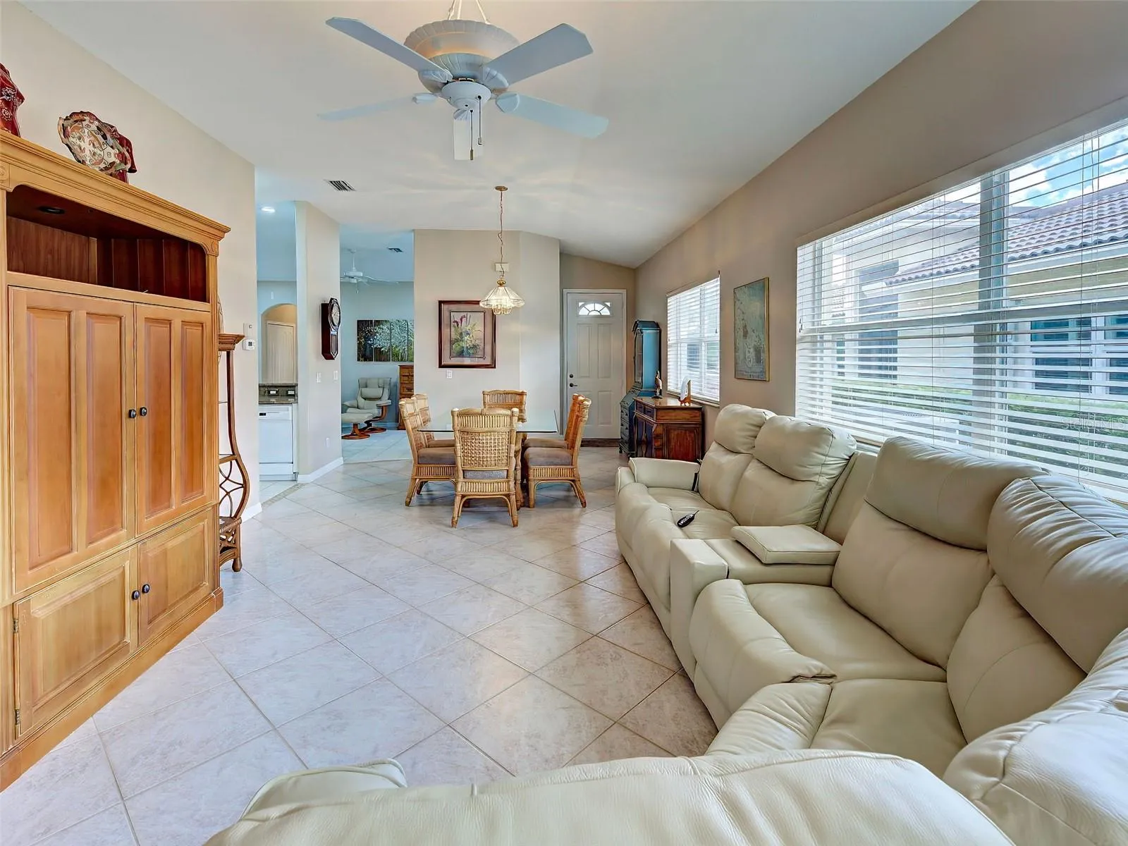 From the lanai, you have open sight to the living area, dining area, kitchen and den/flex room.