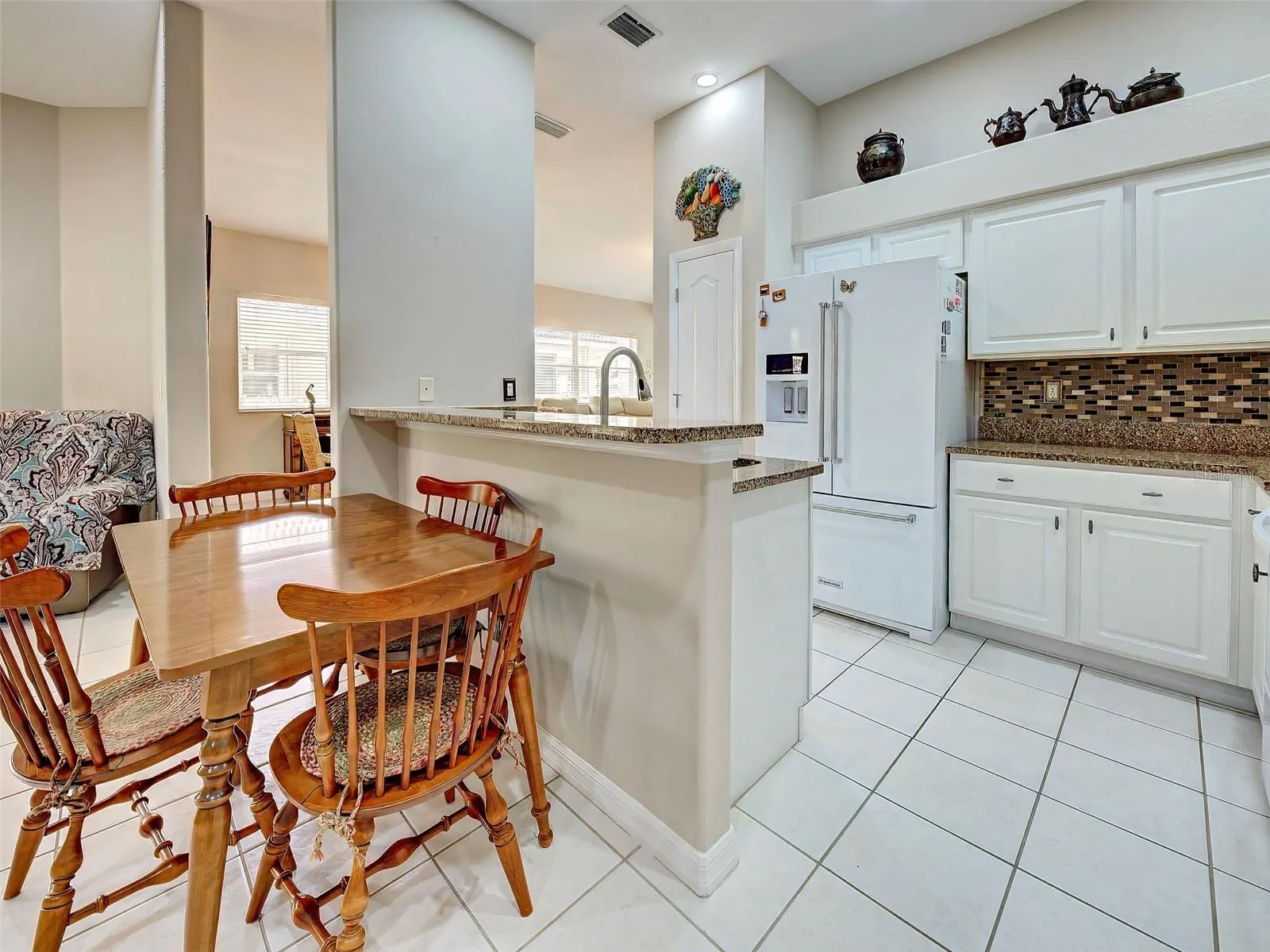 There is room for an informal dining area, or replace the table and chairs with bar stools.