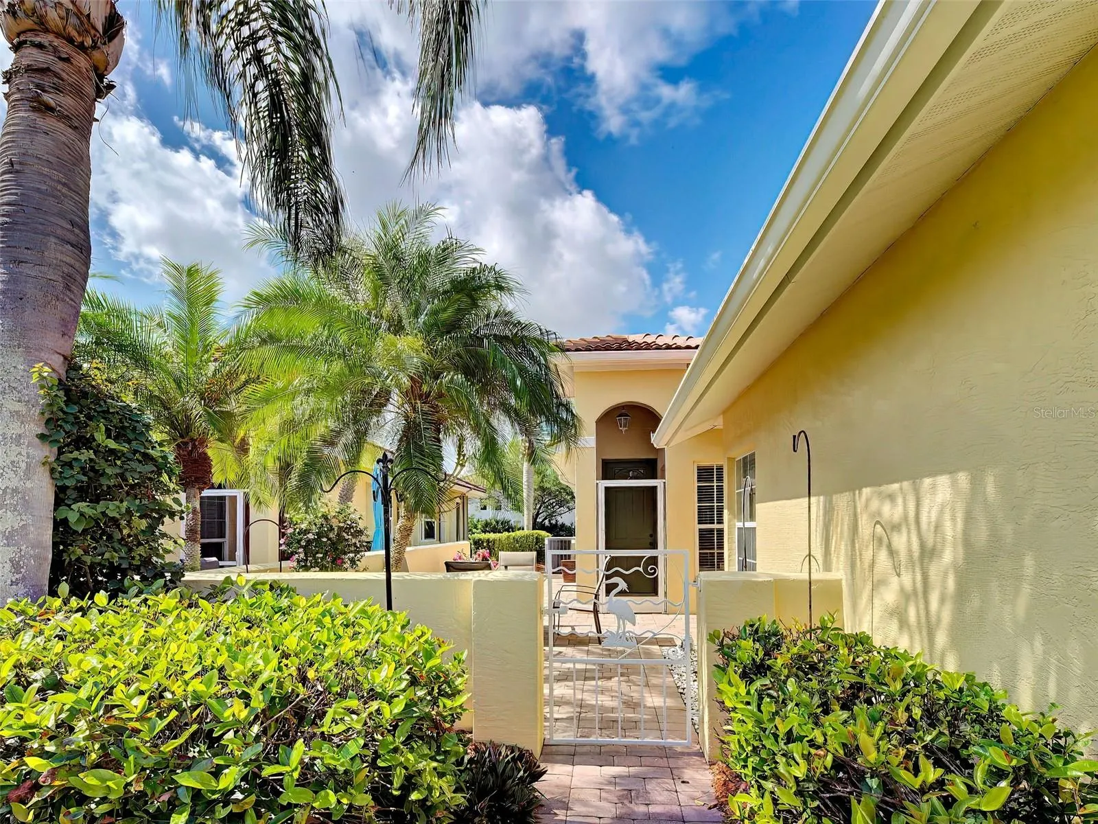 Enter the gate to your private patio with a side entrance.