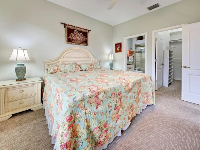The carpeted primary bedroom has a walk-in closet and an ensuite bathroom.