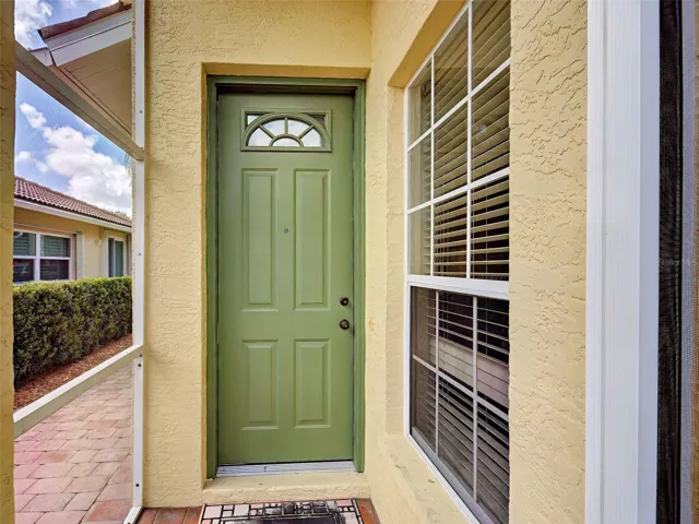 Enter the home with open floor plan through the front door.