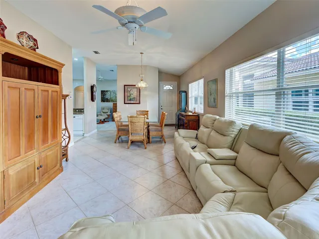 From the lanai, you have open sight to the living area, dining area, kitchen and den/flex room.