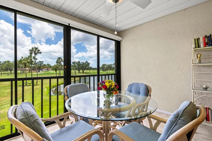View of golf course from enclosed lanai