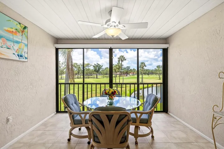 View of golf course from enclosed lanai