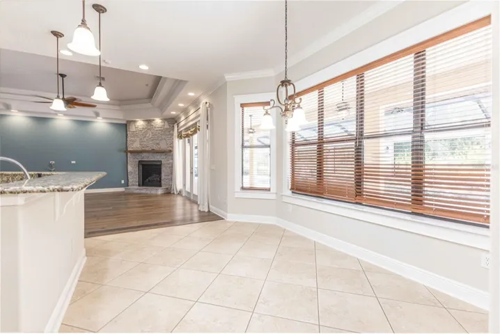 Dining space in kitchen overlooking pool