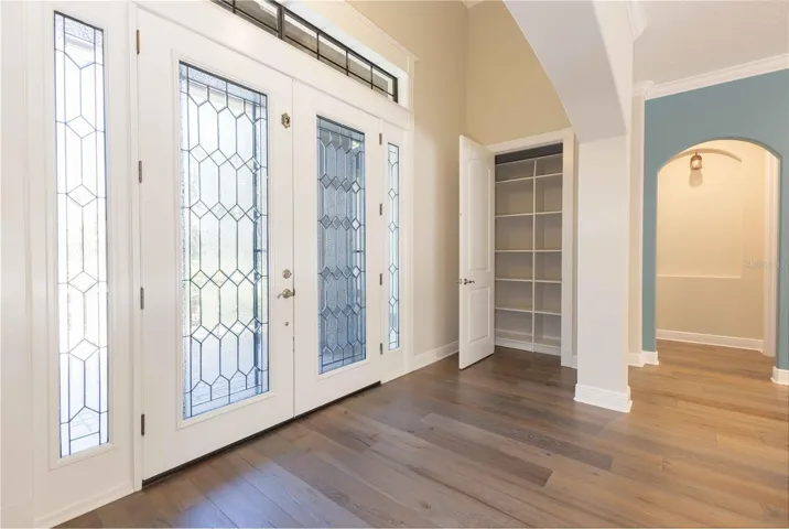 Front entrance to home with coat closet