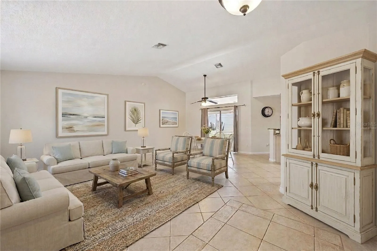 Virtually Staged foyer, formal living and dining