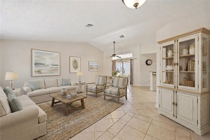 Virtually Staged foyer, formal living and dining