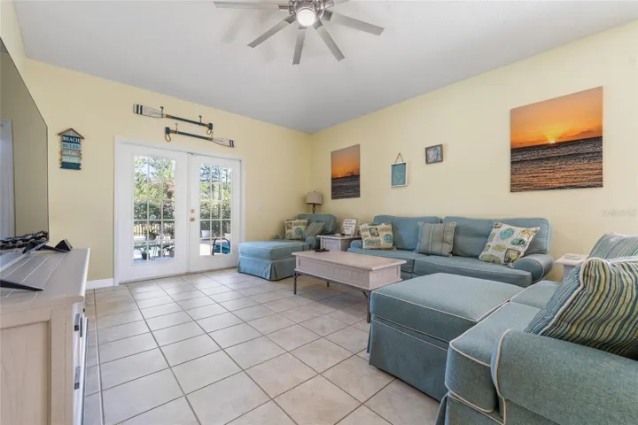 Family Room with french doors to porch and private backyard