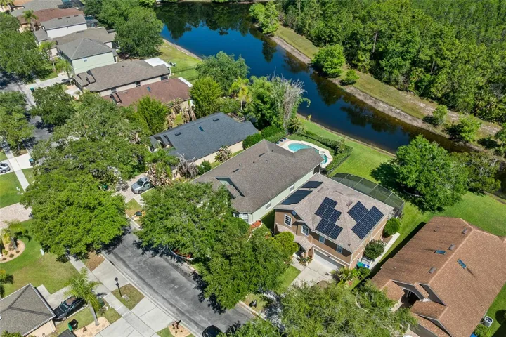 Aerial showing pond and conservation area behind home