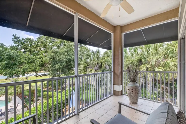 Private screened balcony off of Primary Bedroom