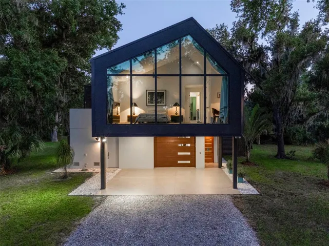 Twilight Guest House Glowing Beneath the Oak Canopy