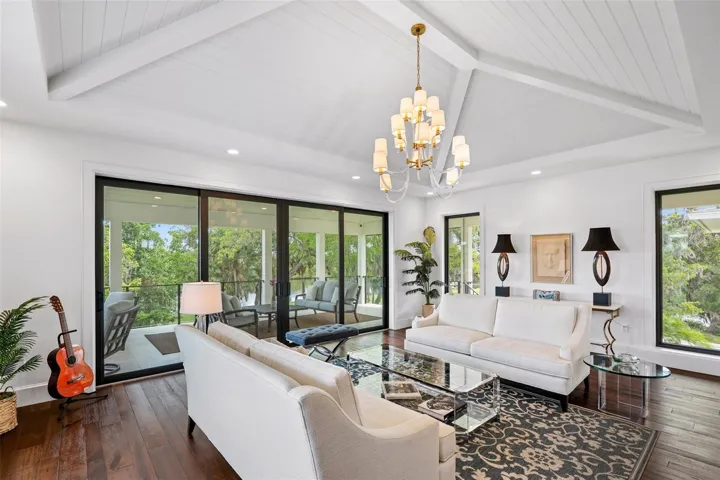 Vaulted Living Room with Whitewashed Tongue-and-Groove Detailing