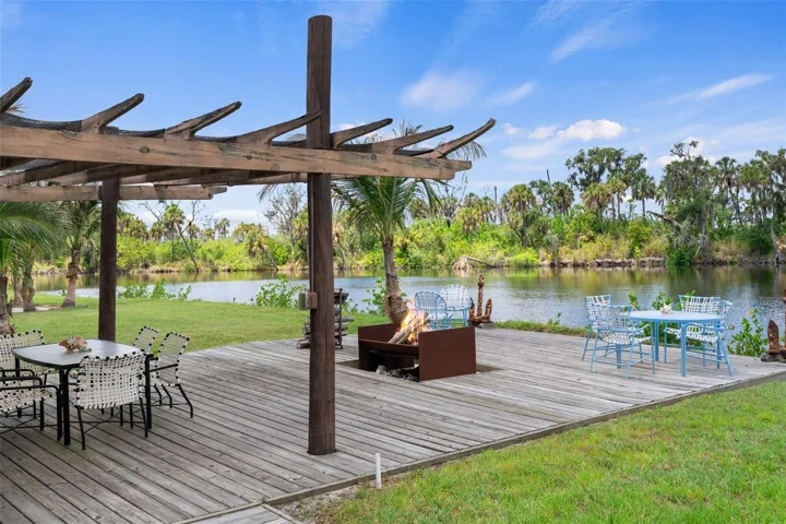 Pergola-Covered Outdoor Lounge Overlooking The Manatee River