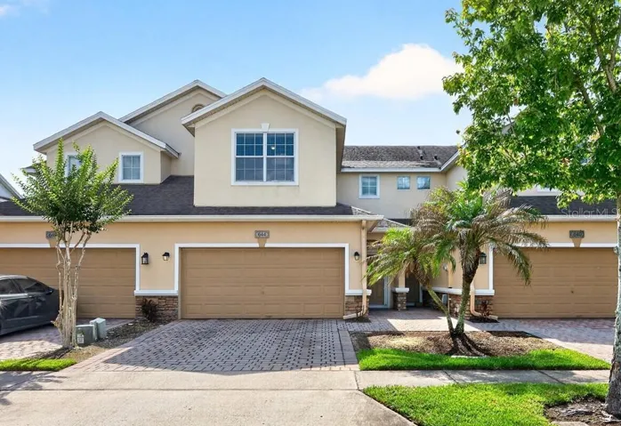 MOVE-IN READY and thoughtfully UPDATED, this spacious townhome in the sought-after Woodland Terrace at Timber Springs community delivers the LOW MAINTENANCE lifestyle you have been searching for in East Orlando!